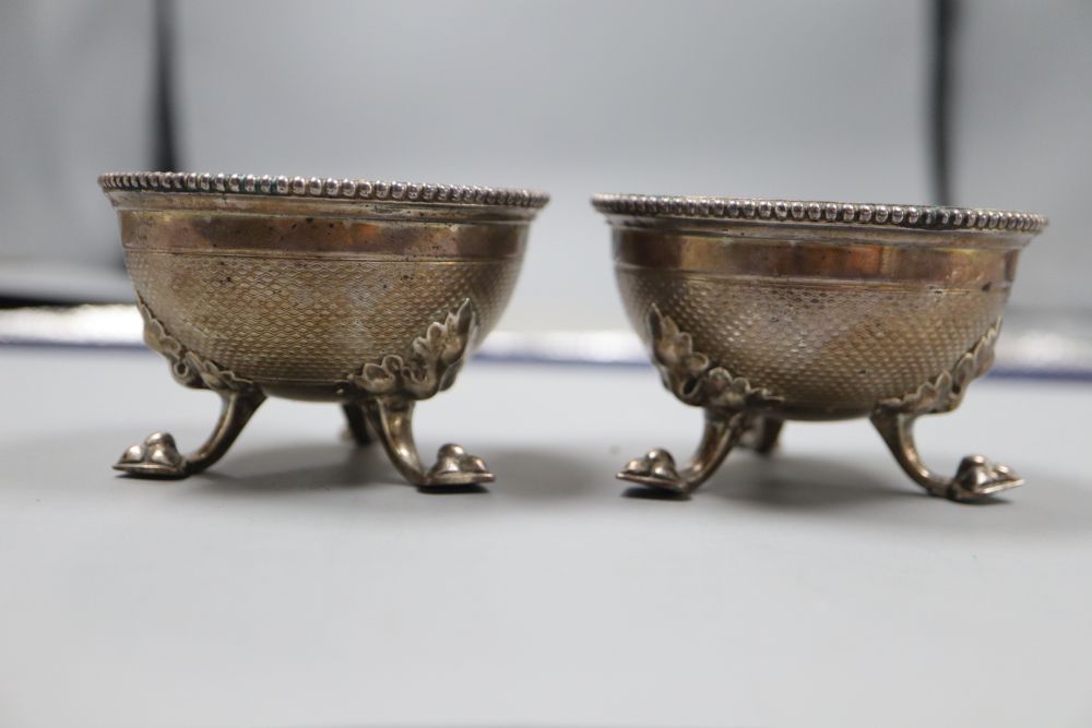 A pair of Victorian silver salts by Hunt & Roskell, London, 1864, diameter 78mm, 8oz, lacking one later liner.